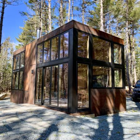 Modern Modular Prefab Clad in Red Clay Coloured Corrugated Steel Siding